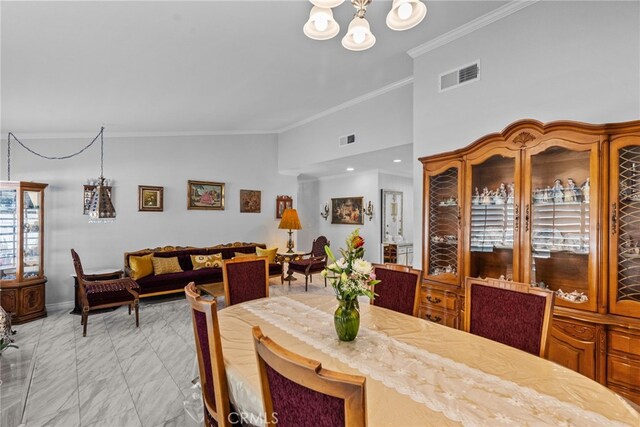 dining area with light marble finish floors, ornamental molding, a chandelier, baseboards, and lofted ceiling