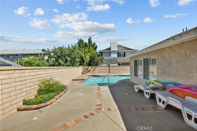 view of pool featuring a fenced backyard and a patio area