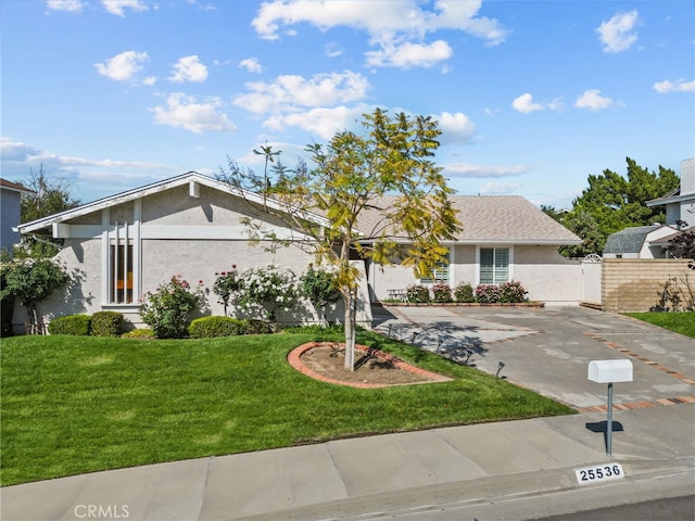 25536 Old Course Way, Valencia, CA 91355 - mid-century modern home with stucco siding and driveway