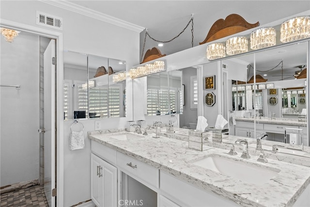 full bathroom featuring ornamental molding and double vanity