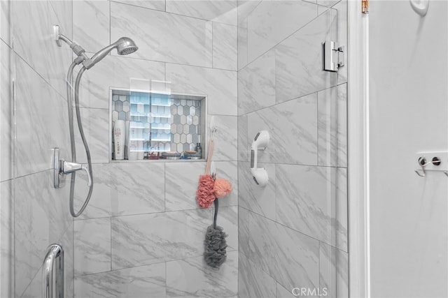 bathroom with a shower stall