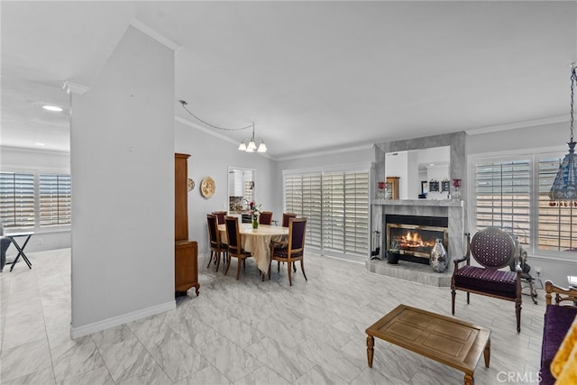 25536 Old Course Way, Valencia, CA 91355 - dining space with crown molding, a tile fireplace, and a chandelier