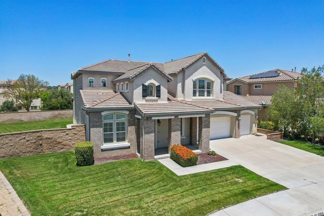 31332 Bluebeech Ct, Temecula, CA 92592 - view of front of house featuring concrete driveway, brick siding, a front lawn, stucco siding, and a tile roof