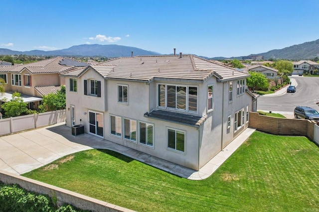 31332 Bluebeech Ct, Temecula, CA 92592 - back of house with a mountain view, a fenced backyard, stucco siding, and a patio