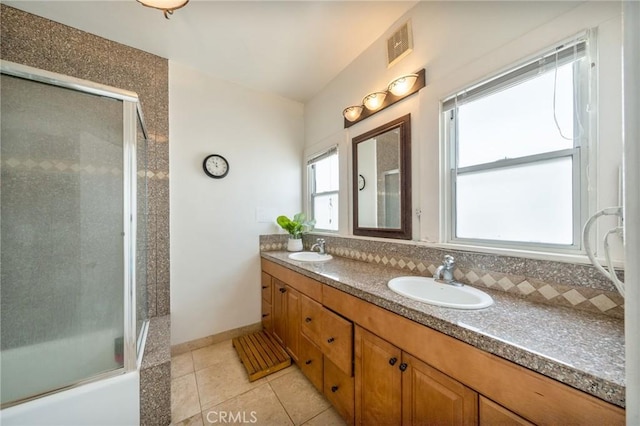 851 Crenshaw Blvd, Los Angeles, CA 90005 - bathroom featuring tile patterned floors, double vanity, decorative backsplash, and baseboards