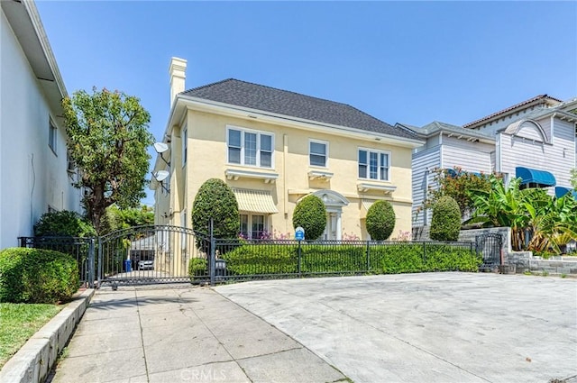 851 Crenshaw Blvd, Los Angeles, CA 90005 - view of front facade with fence, a chimney, stucco siding, and a gate