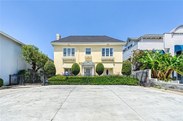 851 Crenshaw Blvd, Los Angeles, CA 90005 - view of front of home with a gate, stucco siding, fence, and a chimney