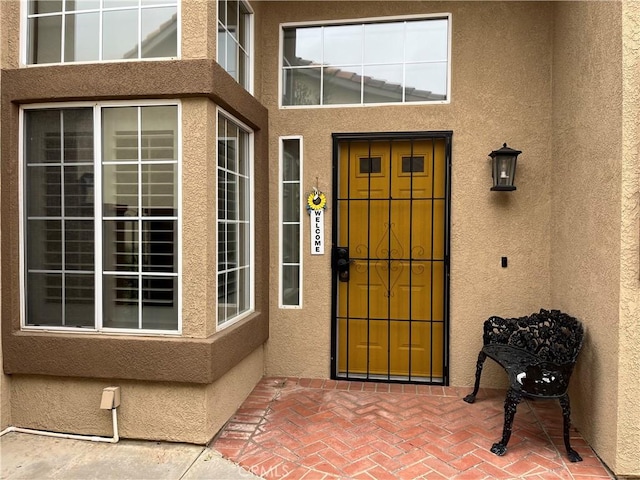 1321 Cypress Point Dr, Banning, CA 92220 - doorway to property with stucco siding