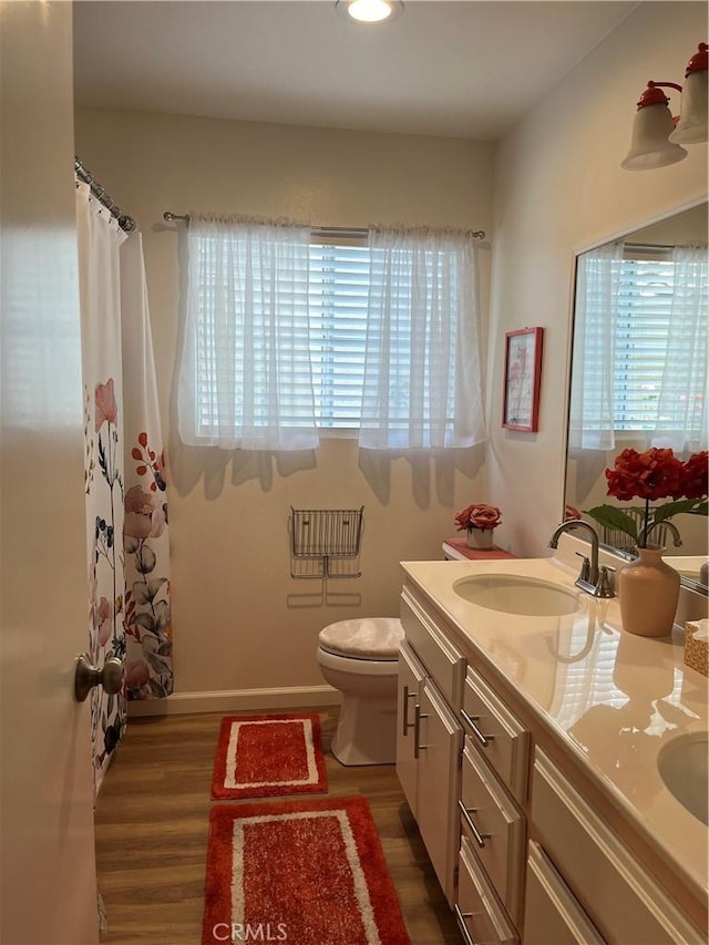 1321 Cypress Point Dr, Banning, CA 92220 - full bathroom with plenty of natural light, vanity, toilet, wood finished floors, and recessed lighting