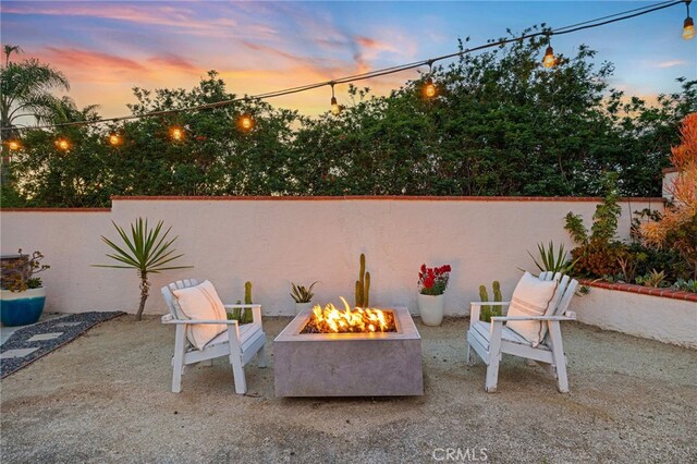3388 Tonopah St, Oceanside, CA 92054 - patio terrace at dusk featuring a fire pit and fence