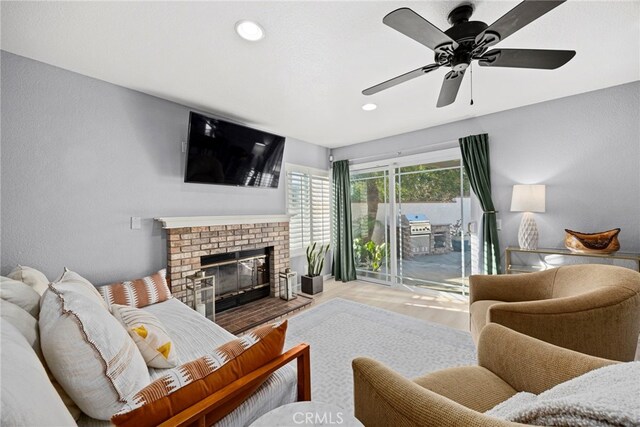 3388 Tonopah St, Oceanside, CA 92054 - living room with wood finished floors, a fireplace, a ceiling fan, and recessed lighting
