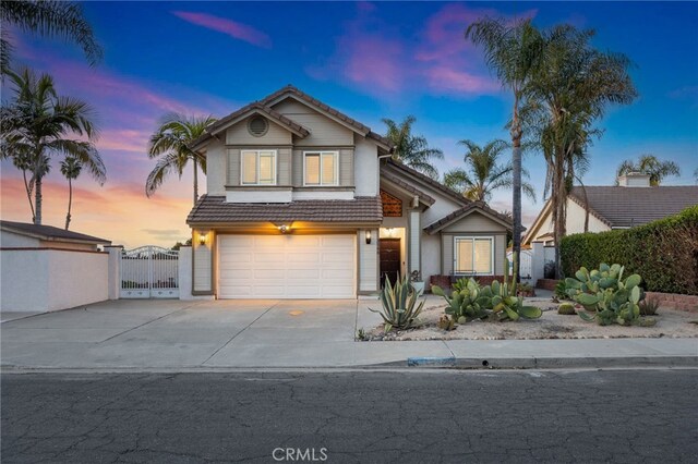 3388 Tonopah St, Oceanside, CA 92054 - traditional-style house with a tile roof, driveway, a garage, and a gate