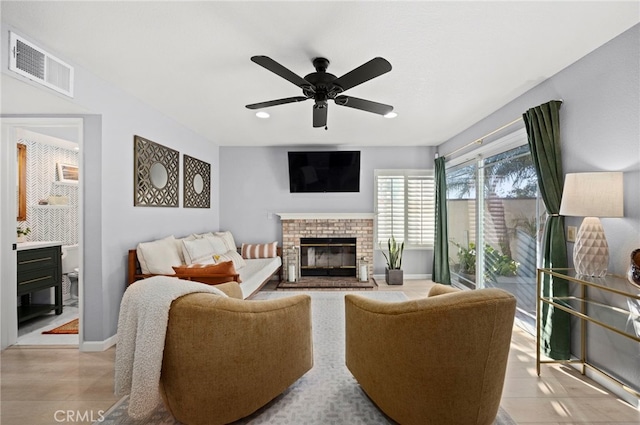 3388 Tonopah St, Oceanside, CA 92054 - living area with a brick fireplace, ceiling fan, baseboards, and recessed lighting