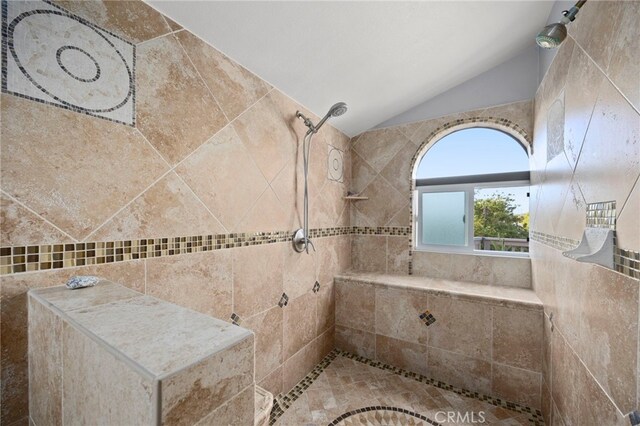 3388 Tonopah St, Oceanside, CA 92054 - bathroom with lofted ceiling, tiled shower, and tile walls