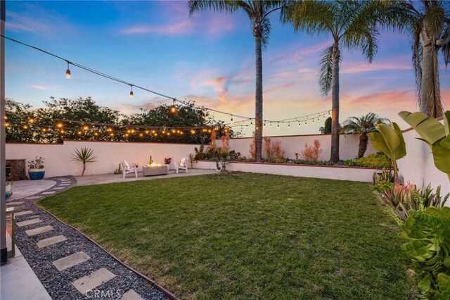 3388 Tonopah St, Oceanside, CA 92054 - yard at dusk with a patio area and an outdoor fire pit