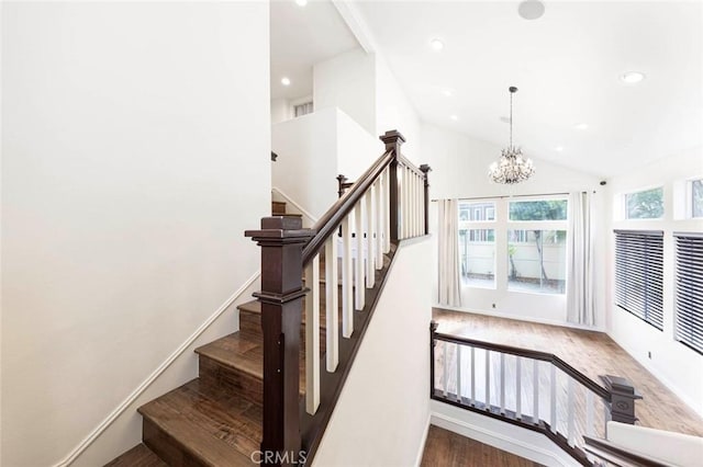 127 Lessay, Newport Coast, CA 92657 - stairway featuring wood finished floors, a chandelier, recessed lighting, and high vaulted ceiling