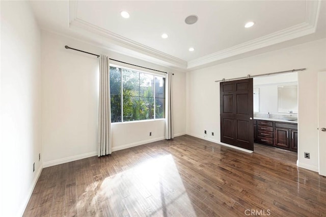 127 Lessay, Newport Coast, CA 92657 - unfurnished bedroom with a raised ceiling, crown molding, dark wood-type flooring, baseboards, and recessed lighting