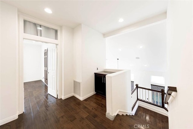 127 Lessay, Newport Coast, CA 92657 - corridor featuring an upstairs landing, wood finished floors, baseboards, and recessed lighting