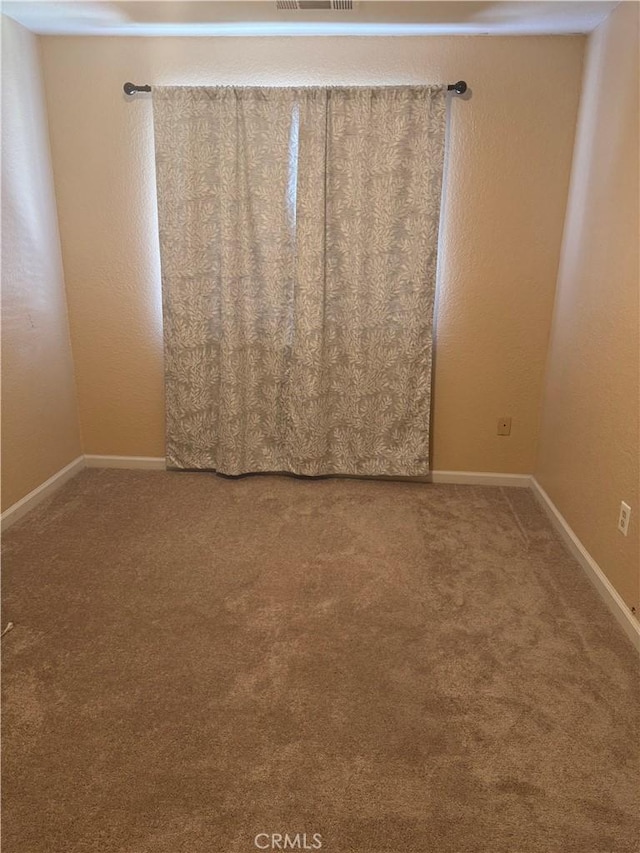 455 Cherry Ln Unit K, Manteca, CA 95337 - carpeted empty room with baseboards