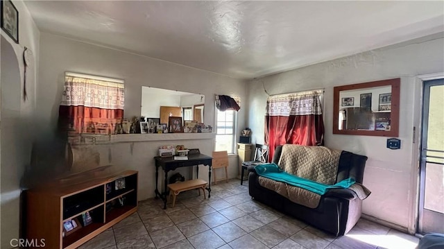 living area with tile patterned flooring