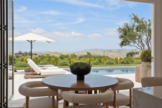 4177 Prado De Los Pajaros, Calabasas, CA 91302 - view of patio / terrace with an outdoor pool and a mountain view
