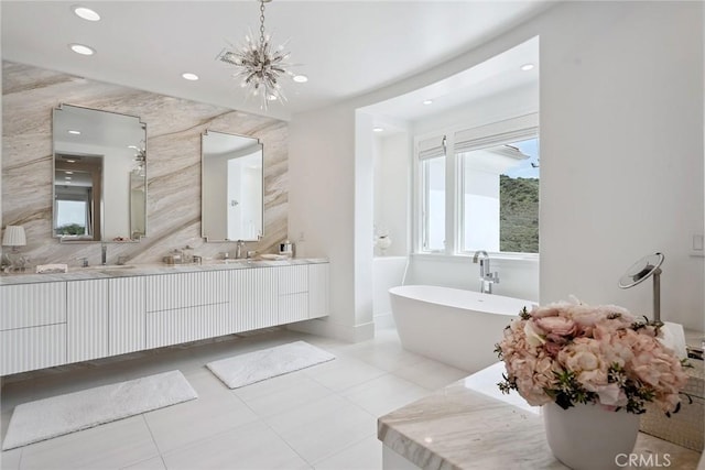 4177 Prado De Los Pajaros, Calabasas, CA 91302 - full bath featuring a chandelier, a freestanding tub, double vanity, recessed lighting, and tile patterned flooring