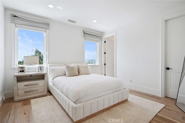 4177 Prado De Los Pajaros, Calabasas, CA 91302 - bedroom featuring light wood-style floors, multiple windows, recessed lighting, and baseboards