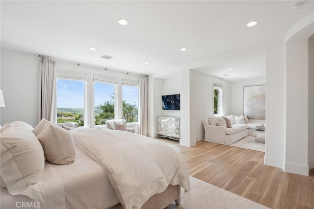 4177 Prado De Los Pajaros, Calabasas, CA 91302 - bedroom featuring baseboards, light wood-style floors, recessed lighting, and arched walkways