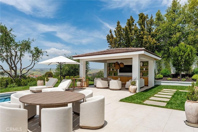 4177 Prado De Los Pajaros, Calabasas, CA 91302 - view of patio with outdoor dining area and an outbuilding