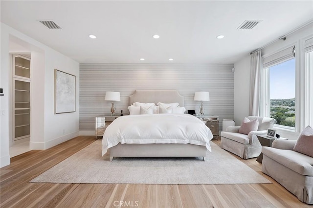 4177 Prado De Los Pajaros, Calabasas, CA 91302 - bedroom featuring an accent wall, wallpapered walls, baseboards, recessed lighting, and light wood-style floors