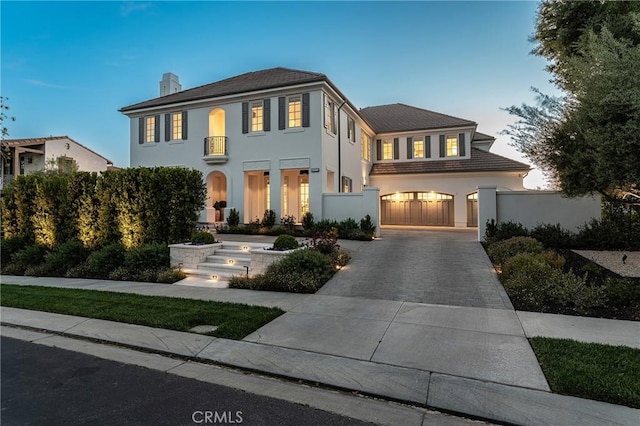 4177 Prado De Los Pajaros, Calabasas, CA 91302 - view of front of house with driveway, stucco siding, and a chimney