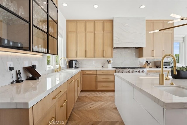 4177 Prado De Los Pajaros, Calabasas, CA 91302 - kitchen with light brown cabinets, a sink, stainless steel gas cooktop, healthy amount of natural light, and recessed lighting