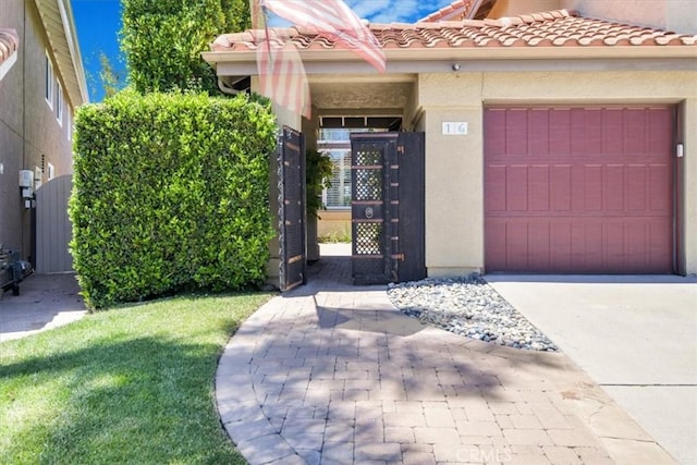 16 Vistamar Dr, Laguna Niguel, CA 92677 - view of front of home with a gate, an attached garage, stucco siding, and concrete driveway