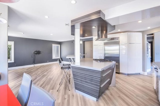 16 Vistamar Dr, Laguna Niguel, CA 92677 - kitchen featuring modern cabinets, white cabinets, light wood-type flooring, appliances with stainless steel finishes, and recessed lighting