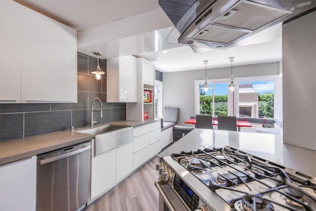 16 Vistamar Dr, Laguna Niguel, CA 92677 - kitchen featuring appliances with stainless steel finishes, ventilation hood, white cabinetry, modern cabinets, and tasteful backsplash