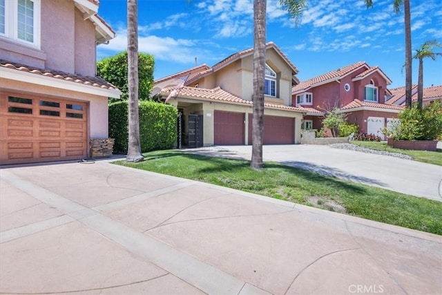 16 Vistamar Dr, Laguna Niguel, CA 92677 - mediterranean / spanish house with concrete driveway, stucco siding, an attached garage, a tiled roof, and a front lawn