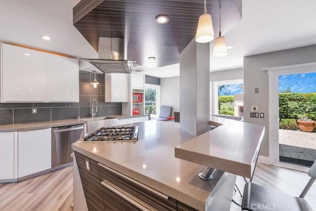 16 Vistamar Dr, Laguna Niguel, CA 92677 - kitchen with appliances with stainless steel finishes, modern cabinets, white cabinetry, light wood-type flooring, and recessed lighting