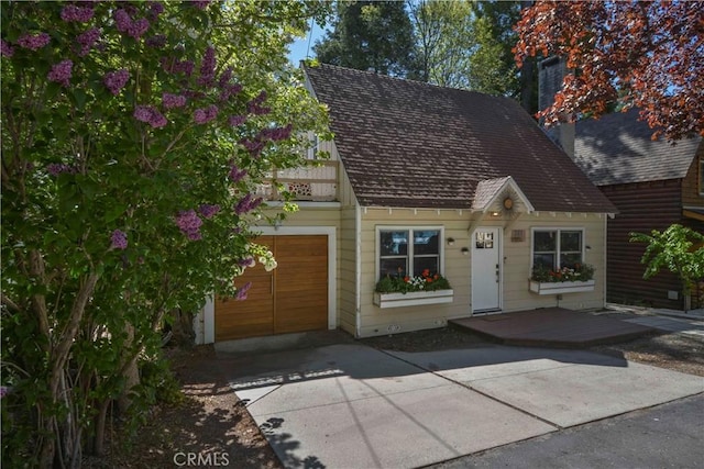 381 Maple Dr, Lake Arrowhead, CA 92352 - view of front of home with an attached garage and driveway