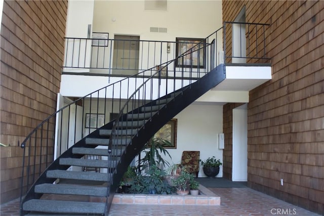 28691 Via Las Flores Unit 326, Murrieta, CA 92563 - staircase featuring a high ceiling