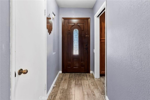 2271 Kellogg Park Dr, Pomona, CA 91768 - doorway featuring light wood finished floors and baseboards