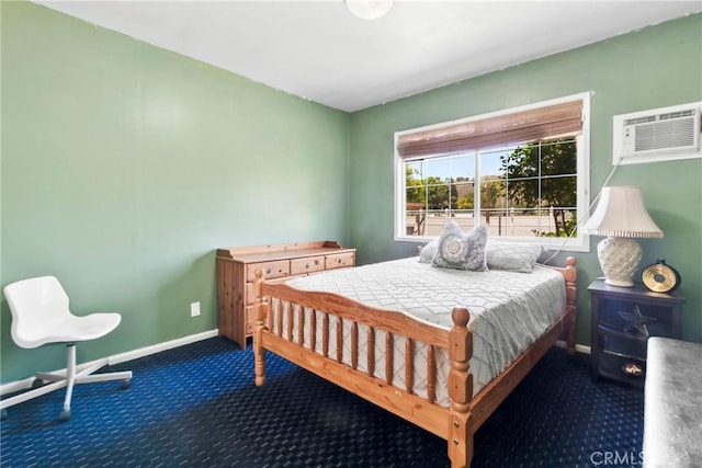2271 Kellogg Park Dr, Pomona, CA 91768 - carpeted bedroom featuring a wall unit AC and baseboards