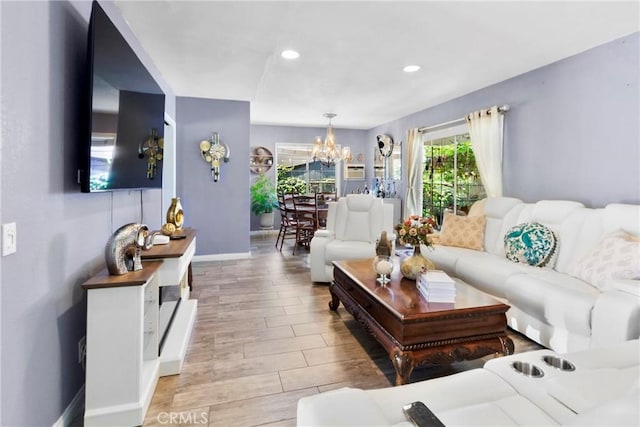 2271 Kellogg Park Dr, Pomona, CA 91768 - living room with a chandelier, baseboards, light wood-style floors, and recessed lighting