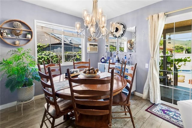 2271 Kellogg Park Dr, Pomona, CA 91768 - dining room with a chandelier, healthy amount of natural light, and wood finished floors