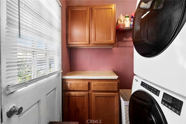 2271 Kellogg Park Dr, Pomona, CA 91768 - laundry room featuring cabinet space and estacked washer and dryer