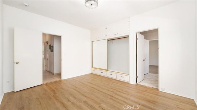 1511 Coolidge Ave, Pasadena, CA 91104 - unfurnished bedroom featuring light wood-style flooring, a closet, and baseboards