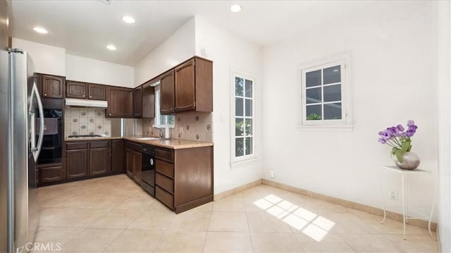 1511 Coolidge Ave, Pasadena, CA 91104 - kitchen with under cabinet range hood, backsplash, freestanding refrigerator, black dishwasher, and recessed lighting