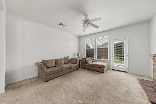 12750 Jack Ln, Eastvale, CA 92880 - living room with a ceiling fan, carpet, baseboards, and a fireplace