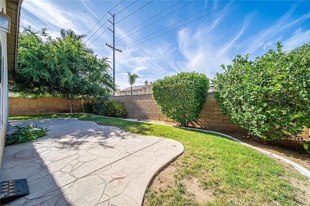 12750 Jack Ln, Eastvale, CA 92880 - fenced backyard with a patio area