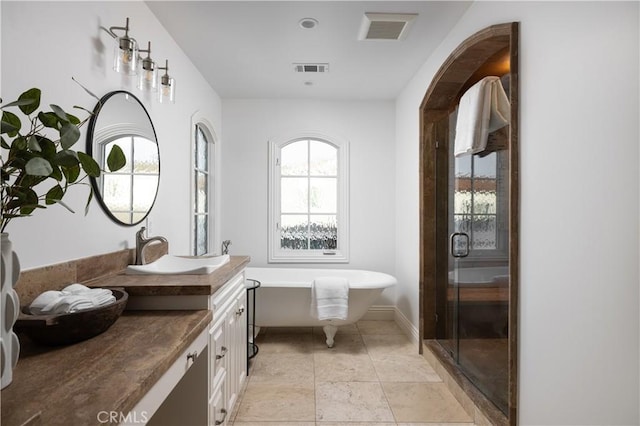 110 Via Orvieto, Newport Beach, CA 92663 - bathroom featuring vanity, a soaking tub, and a stall shower