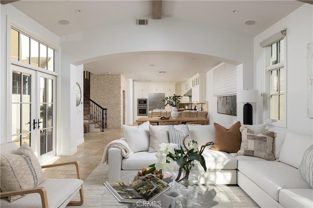 110 Via Orvieto, Newport Beach, CA 92663 - living room with arched walkways, stairs, and french doors